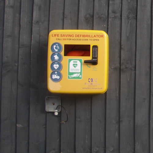 yellow defibrillator cabinet